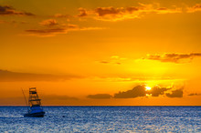 Beautiful Sunset Behind Sport Fishing Boat On Maui, Hawaii, USA