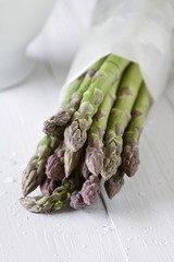 Wall Mural - Green asparagus wrapped in paper