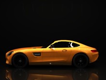 Sports Car Left View. The Image Of A Sports Gold Car On A Black Background.