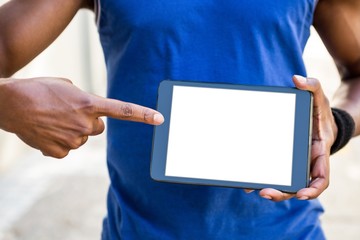 Poster - Athletic man using tablet computer