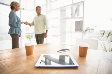 Poster - Two business colleagues shaking hands