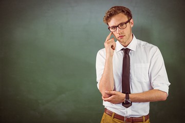 Canvas Print - Composite image of young businessman thinking looking at camera