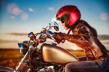 Wall Mural - Biker girl on a motorcycle