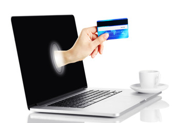 Laptop with credit card in hand isolated on white