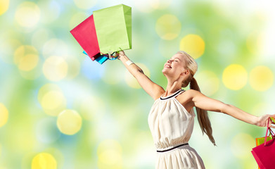 Sticker - smiling woman with shopping bag rising hands