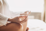Yoga woman meditating and practicing yoga at home. Recreation, self care, yoga training, fitness, breathing exercises, meditation, relaxation, healthy lifestyle, mindfulness concept