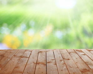 Wall Mural - Wooden table  with abstract  blur background