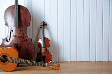 Wall Mural - Musical instruments on wooden planks background