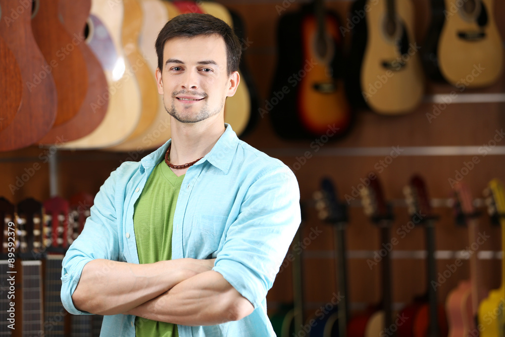 Handsome young man in music store