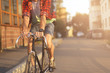 Close up hipster on bike in the city at sunset. Shot with