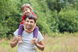 © siaivo - little girl sitting father shoulder