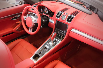 Wall Mural - Red luxury car Interior - steering wheel, shift lever and dashbo