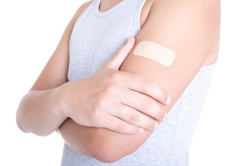 male shoulder with medical adhesive patch isolated on white