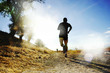 © Wordley Calvo Stock - Silhouette of young sport man running off road cross country competition at summer sunset