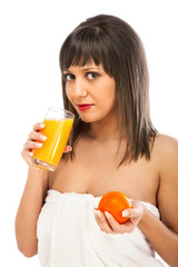 Wall Mural - Young woman drinking orange juice