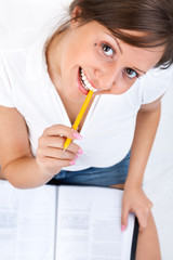 Canvas Print - Young woman taking notes