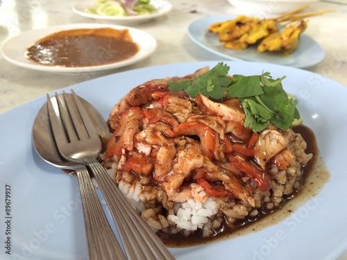 Fototapeta na szkło Roasted pork in sauce with rice