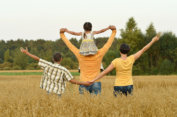 Wall Mural - Happy family in wheat field