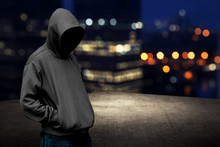 Faceless Man In Hood On The Rooftop