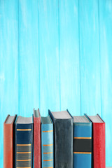 Poster - Retro books on turquoise wooden background