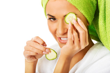 Sticker - Woman in bathrobe applying cucumber on eyes