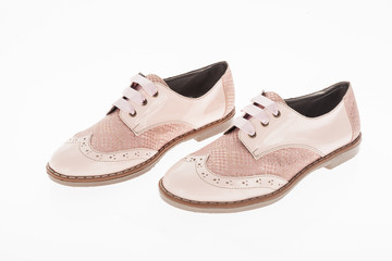  shoe made of pink leather with laces for women on white background