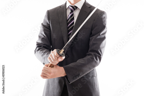 日本刀を持っているスーツのビジネスマン Stock 写真 Adobe Stock