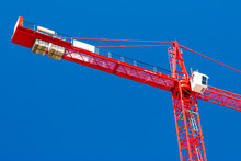 Red Crane With Blue Sky In Background