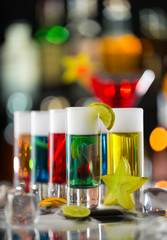 Wall Mural - Colored alcoholic shots on bar counter