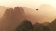 Hot Air Balloon Floating Through Hazy Mountains Covered With Tre
