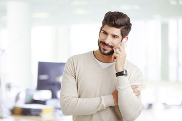 Young businessman with mobile