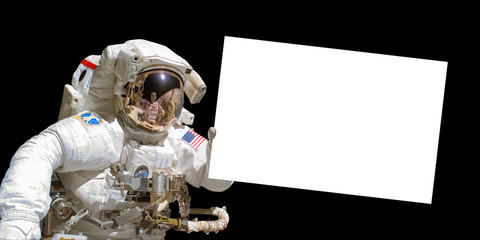 Wall Mural - astronaut in space holding a white blank sign with copy space - elements of this image are provided 