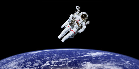 astronaut in outer space over the planet earth. elements of this image furnished by nasa