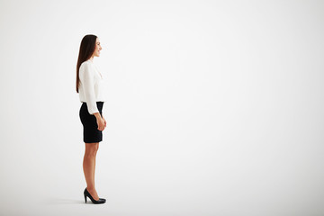 Wall Mural - smiley businesswoman over light grey background