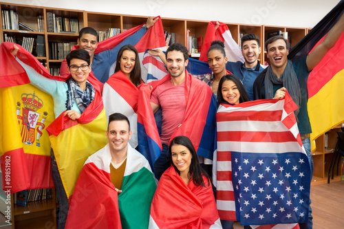 Fotografie, Obraz Excited students presenting their countries with flags