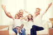 © Syda Productions - smiling parents and two little girls at new home