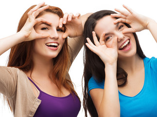 Wall Mural - two young teenagers making faces