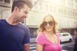 © Joshua Resnick - happy couple walking holding hands on busy in LA with lens flare