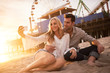 © Joshua Resnick - romantic couple taking selfie together at santa monica near sunset