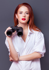 Poster - businesswomen in white shirt with binocular