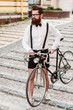 © gstockstudio - Hipster with bicycle.