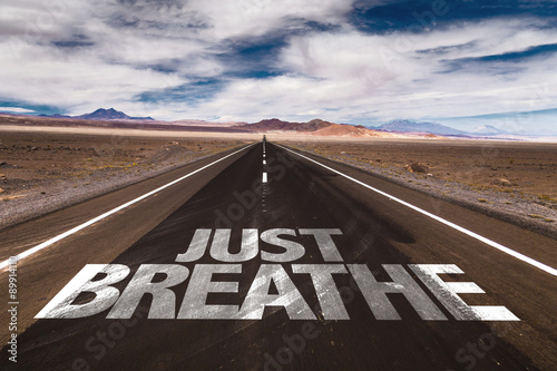 Cuadros en Lienzo Just Breathe written on desert road