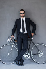 Canvas Print - Businessman with his bicycle.