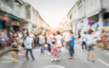 Fototapeta Kosmos - Blurred people on the street in phuket old town