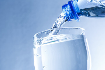 Poster - Pouring water from bottle into glass