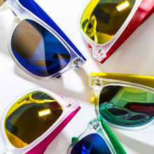 Different Modern Sunglasses Close Up Isolated On A White Background