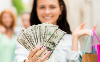 Wall Mural - close up of woman with shopping bags and money