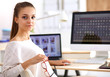 © shefkate - Young woman working in office, sitting at desk