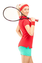 Canvas Print - Young female tennis player holding a racquet