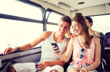 Wall Mural - smiling couple with smartphone making selfie